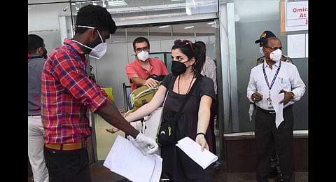 Health workers check passengers for monkeypox symptoms at the Chennai airport. (Photo | Ashwin Prasath)