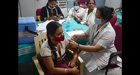 A health worker administers Covid-19 vaccine to a beneficiary at the city’s KC General Hospital on Saturday | Shriram BN