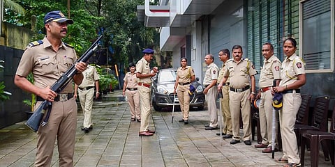 Police personnel deployed outside Shiv Sena MP Rahul Shewale's office, in Mumbai. (Photo | PTI)