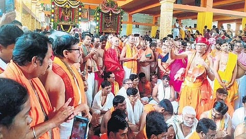 Devotees chant bhajans in front of the chariots at Malakheda | Express