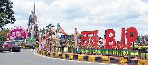 Posters put up by the TRS and BJP at a junction in Hyderabad, on Friday . (Photo| RVK Rao, EPS)
