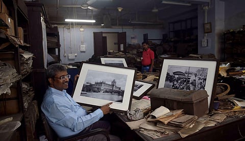 Biplab Roy, the current Administrator General and Official Trustee of West Bengal, shows restored rare objects, photographs of the British ruled India, in Kolkata, on July 19, 2022. (Photo | PTI)