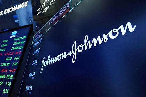The Johnson & Johnson logo appears above a trading post on the floor of the New York Stock Exchange. (File Photo | AP)