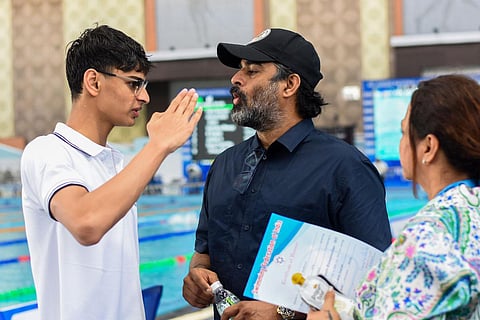 Actor R Madhavan with his son Vedaant share a moment during 48th Junior National Aquati Championship at Kalinga Stadium in Bhubaneswar. (Photo| Debadatta Mallick)