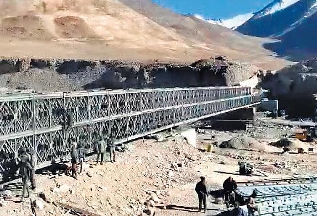 The bailey bridge to Hot Spring being assembled by BRO personnel.