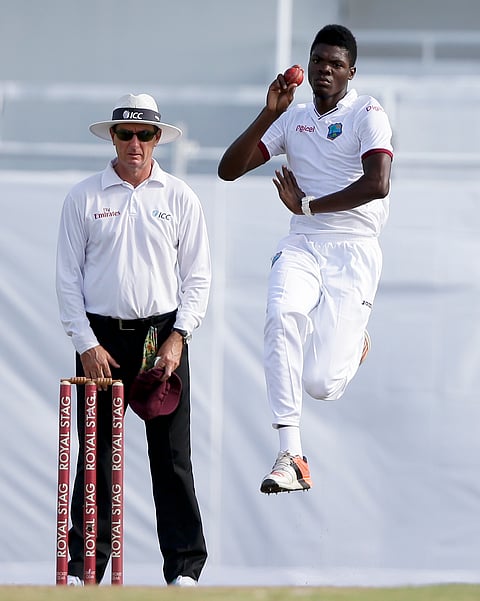 West Indies' Alzarri Joseph bowls against India during day one of the third cricket Test matches. ( Photo | AP)