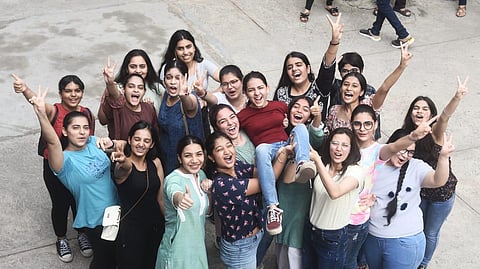 Students celebrate after the declaration of CBSE Class 12 result at St. Thomas School in New Delhi on Friday.(Photo | Parveen Negi, EPS)