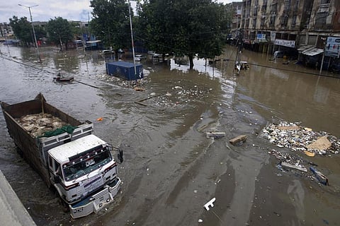 A truck drives through a flooded road after a heavy rainfall in Karachi, Pakistan, Monday, July 11, 2022. (Photo | AP)