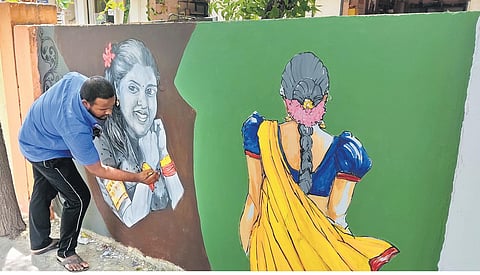 Artist Ajith adorns the compound walls of Perambalur New Bus Stand with lively landscapes of Tamil Nadu | Express