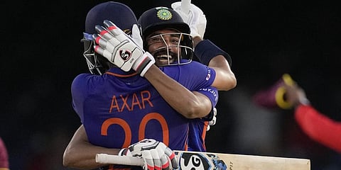 India's Axar Patelis embraced by teammate Mohammed Sirajafter hitting a six to win the second ODI cricket match against West Indies.(Photo | AP)