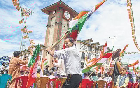 A BJP worker dances during the Tiranga Bikers Rally in Srinagar on Monday. (Photo | PTI)
