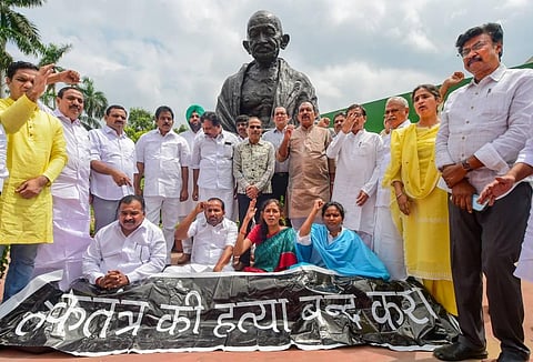Congress MPs stage a protest against ED's interrogation of Congress President Sonia Gandhi in the National Herald case, at Parliament House. (Photo | PTI)