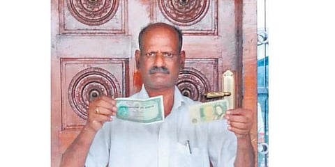 R Manickam showing his collection of old currency notes | Express