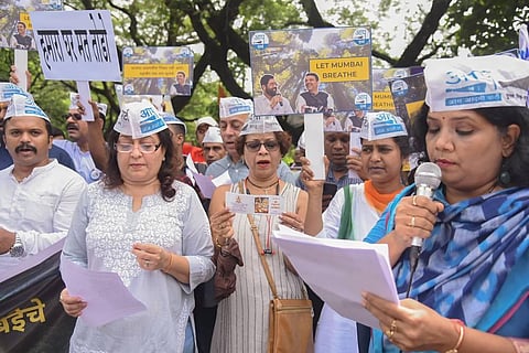 AAP workers raise slogans during a protest as Maharashtra government decides to move the Metro-3 car shed back to Aarey Forest, in Mumbai. (Photo | PTI)