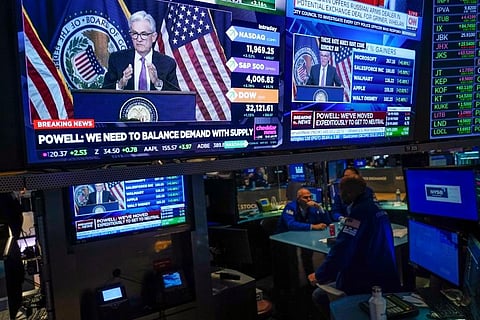 Stocks on Wall Street are solidly higher in afternoon trading Wednesday after the Federal Reserve raised its key interest rate by a widely expected three-quarters of a point. (Photo | AP)