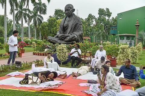 AAP MP Sanjay Singh with TMC MPs Dola Sen and Mausam Noor, and other MPs during their protest at Parliament House complex during ongoing Monsoon Session, in New Delhi, Wednesday. (Photo | PTI)