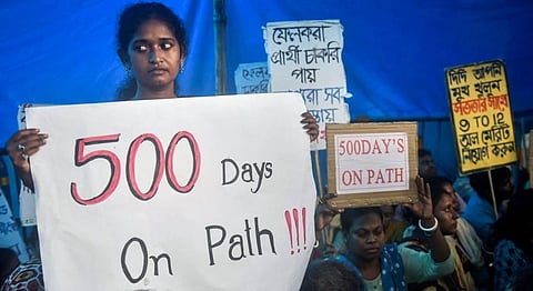State Level Selection Test (SLST) merit list candidates during a protest over SSC scam case, in Kolkata, Wednesday, July 27, 2022. (Photo | PTI)