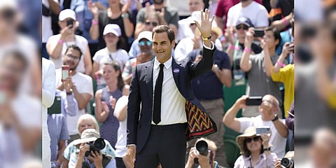 Switzerland's Roger Federer waves during a 100 years of Centre Court celebration on day seven of the Wimbledon tennis championships in London, Sunday, July 3, 2022.(Photo | AP)