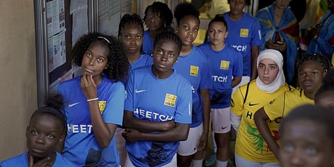 Players wait before entering the field prior to the final women's game of the national cup of working-class neighbourhoods. (Photo | AP)