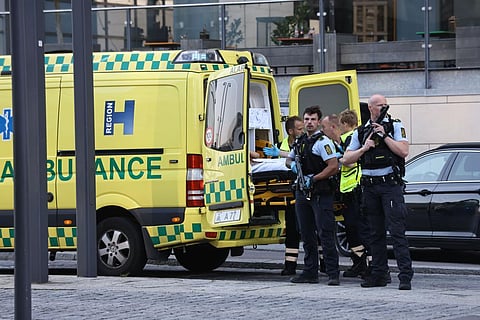 An ambulance and armed police outside the Field's shopping center, in Orestad, Copenhagen, Denmark, Sunday. (Photo | AP)
