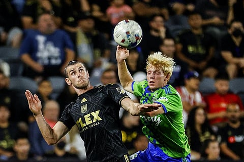 Los Angeles FC forward Gareth Bale, left, and Seattle Sounders midfielder Ethan Dobbelaere vie for the ball during the second half of an MLS soccer match. (Photo | AP)