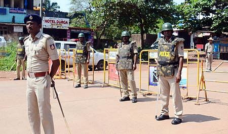 Police Officers patrolling Krishnapura, Mangalapet outskirts of Mangaluru City on Friday following murder of a youth at Surathkal. (Photo | EPS)