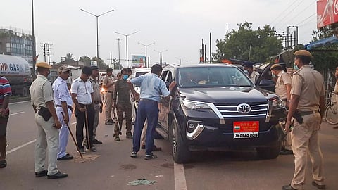 Security personnel recover illegal money during a search operation in a vehicle belonging to Congress MLA, in Ranchi. (Photo | PTI)