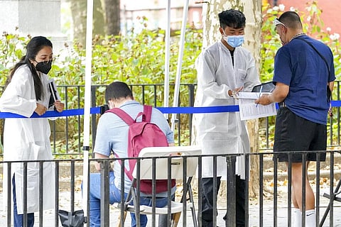 Healthcare workers with New York City Department of Health and Mental Hygiene help people register for the monkeypox vaccine at one of the City's vaccination sites, Tuesday, July 26, 2022(Photo | AP)