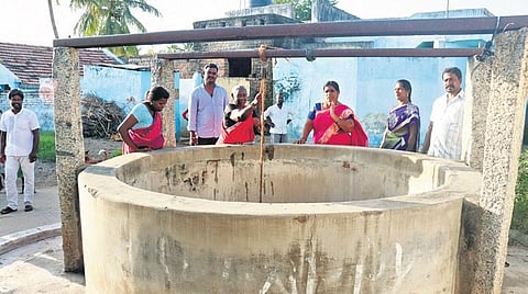 Villagers draw water from a well that was revived from its dilapidated state at Venkatasamudhuiram | s dinesh