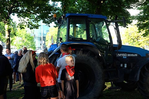 A small group of people gather ahead of a major protest by farmers at a village in central Netherlands, in The Hague, Netherlands. (Photo | AP)