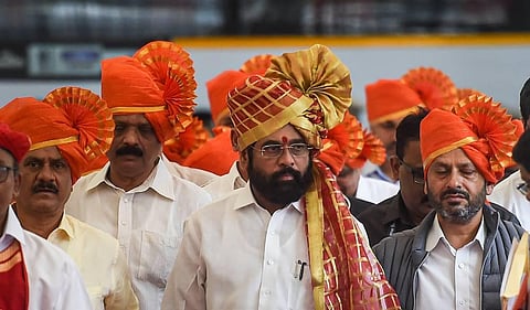 Maharashtra CM Eknath Shinde along with rebel Shiv Sena MLAs arrives for a special session of Maharashtra Assembly, at Vidhan Bhavan in Mumbai. (Photo | PTI)