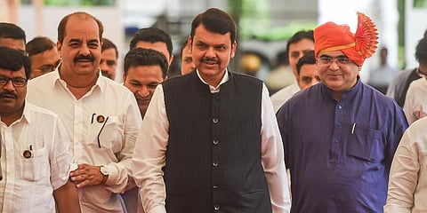 Maharashtra Deputy CM Devendra Fadnavis along with BJP MLAs. (Photo | PTI)