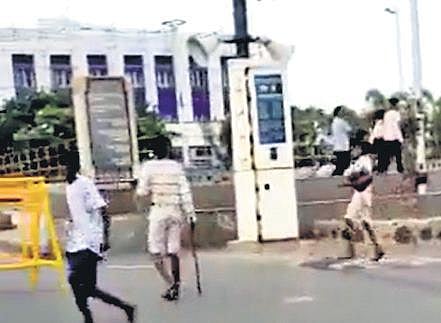 A still from the video showing machete-wielding gang chasing the photographer on the Marina on Sunday morning. (Photo| EPS)