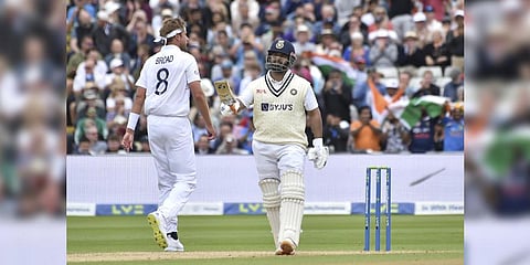 India's Rishabh Pant, right, celebrates scoring fifty runs during the fourth day of the fifth cricket test match between England and India.(Photo | AP)