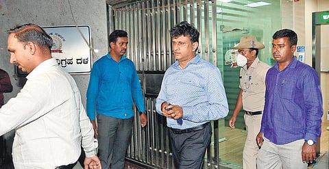 Anti-Corruption Bureau officials arrest IAS officer J Manjunath (centre) in bribery case
