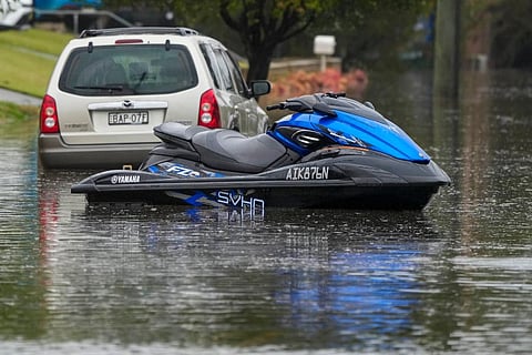 A jets sits in a flooded street at Windsor on the outskirts of Sydney, Australia. (Photo | AP)