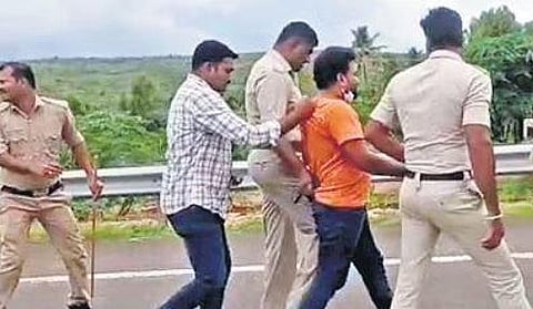 Police escort one of the assailants of Chandrashekara Guruji, who was murdered in a hotel in Hubballi on Tuesday | Express