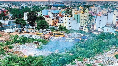 Smoke billows out from a dumpyard at Veerabhadra Nagar in Banashankari 3rd Stage where garbage dumping is rampant | EXPRESS