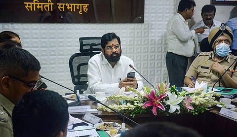 Maharashtra Chief Minister Eknath Shinde and disaster management officials during a meeting to review the preparedness to deal with flood situations due to heavy monsoon rains. (Photo | PTI)