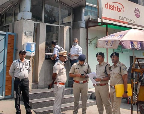 Chhattisgarh Police personnel give a notice to the local police in the Sector 20 Police Station regarding the arrest of Zee News anchor Rohit Ranjan, in Noida. (Photo | PTI)