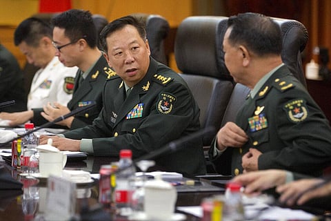 Gen. Li Zuocheng, center, speaks during a meeting with U.S. Army Chief of Staff Gen. Mark Milley, not shown, at the Bayi Building in Beijing. (Photo | AP)