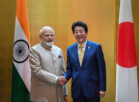 Prime Minister Narendra Modi shakes hands with his Japanese counterpart Shinzo Abe prior to their meeting in Osaka, Japan. (File | PTI)