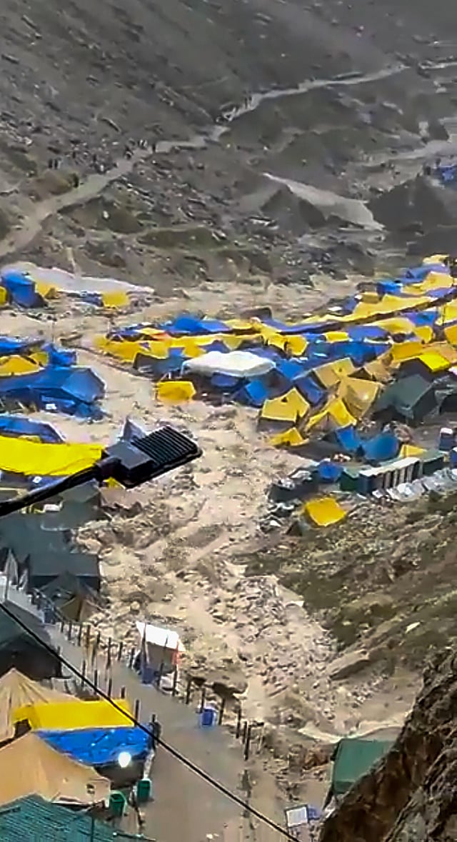 The heavy rain on July 8 evening near the mountain cave shrine revered by Hindus sent a wall of water down a gorge and swept away about two dozen camps and two makeshift kitchens, officials said. An estimated 10,000 people were in the mountains when the rains struck. (Photo | PTI)