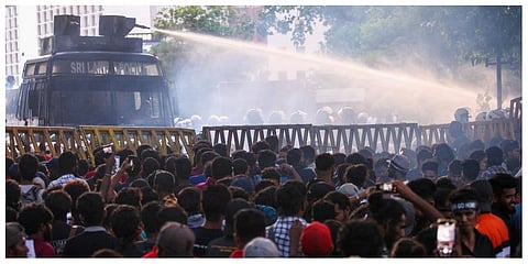 Police use a water canon to disperse demonstrators taking part in an anti-government protest demanding the resignation of Sri Lanka's President Gotabaya Rajapaksa. (Photo | AFP)