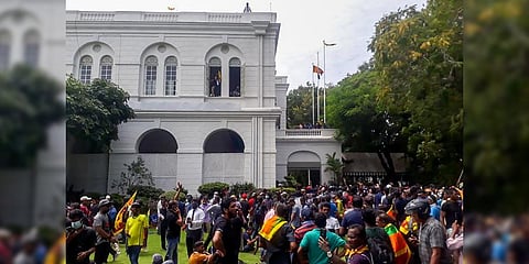Protestors gather inside the compound of Sri Lanka's Presidential Palace in Colombo on July 9, 2022.(Photo | AFP)