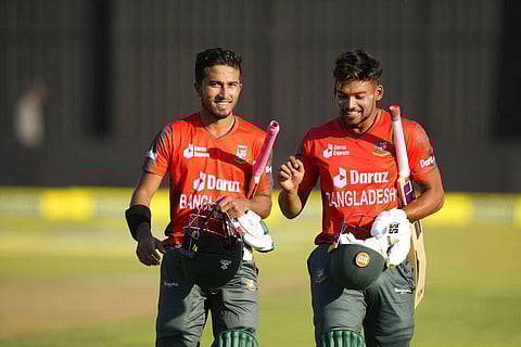 Bangladesh batsman Najmul Hossain Shanto, left, and Afif Hossa walk off the pitch at the end of the T20 match between Zimbabwe and Bangladesh. (Photo | AP)