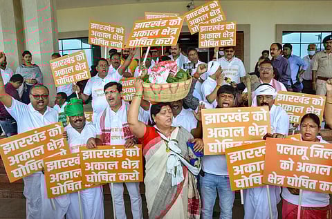 BJP MLAs, in farmer's attire, stage a demonstration demanding from the state government to declare Jharkhand as drought-hit region, in Ranchi. (Photo | PTI)
