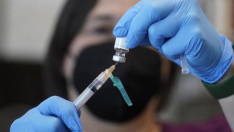 A registered nurse prepares a dose of a Monkeypox vaccine at the Salt Lake County Health Department. (Photo | AP)