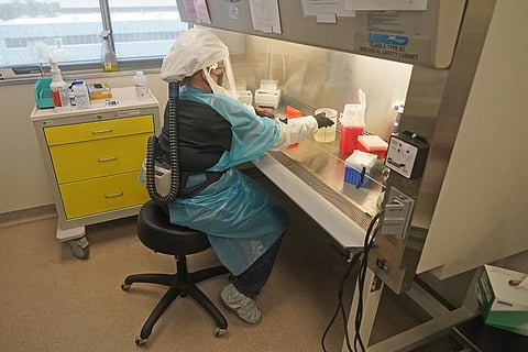 Microbiologist Annette Atkinson demonstrates how monkeypox is tested for at the Utah Public Health Laboratory. (Photo | AP)