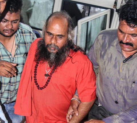 Vairagyanand Giri alias Mirchi Baba being produced in the district court following his arrest for allegedly raping a woman, in Bhopal. (Photo | PTI)